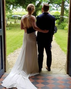 Bride and groom at their wedding ceremony in the British countryside