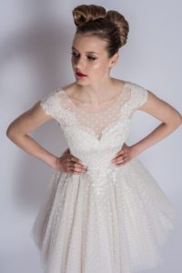 Summer wedding dress with V-neckline by Loulou Bridal at Boho Bride Boutique in Stratford