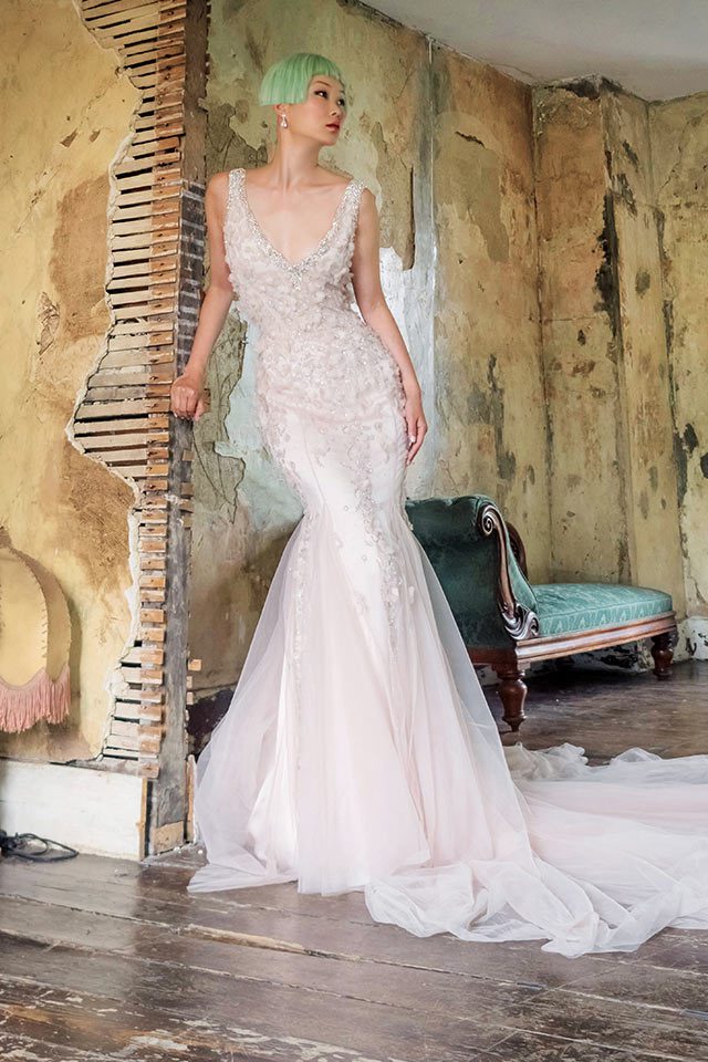 Elaborately designed, unique lace designer wedding dress with plunging neckline and open back with keyhole feature back in Warwickshire, UK