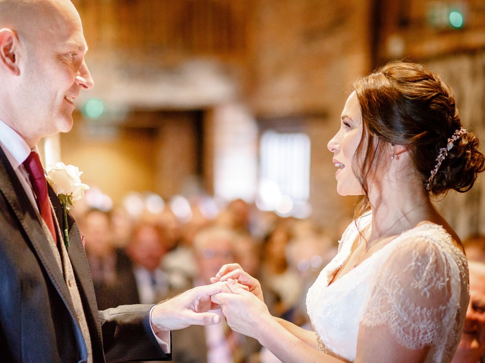 Exchanging vows at wedding venue Curradine Barns Shrawley