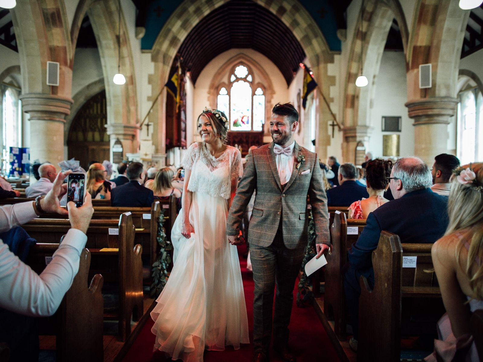 Bride wearing lace bolero from Boho Bride Boutique