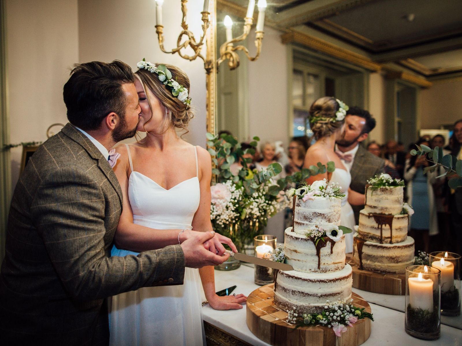 Cutting semi naked three tier cake cake