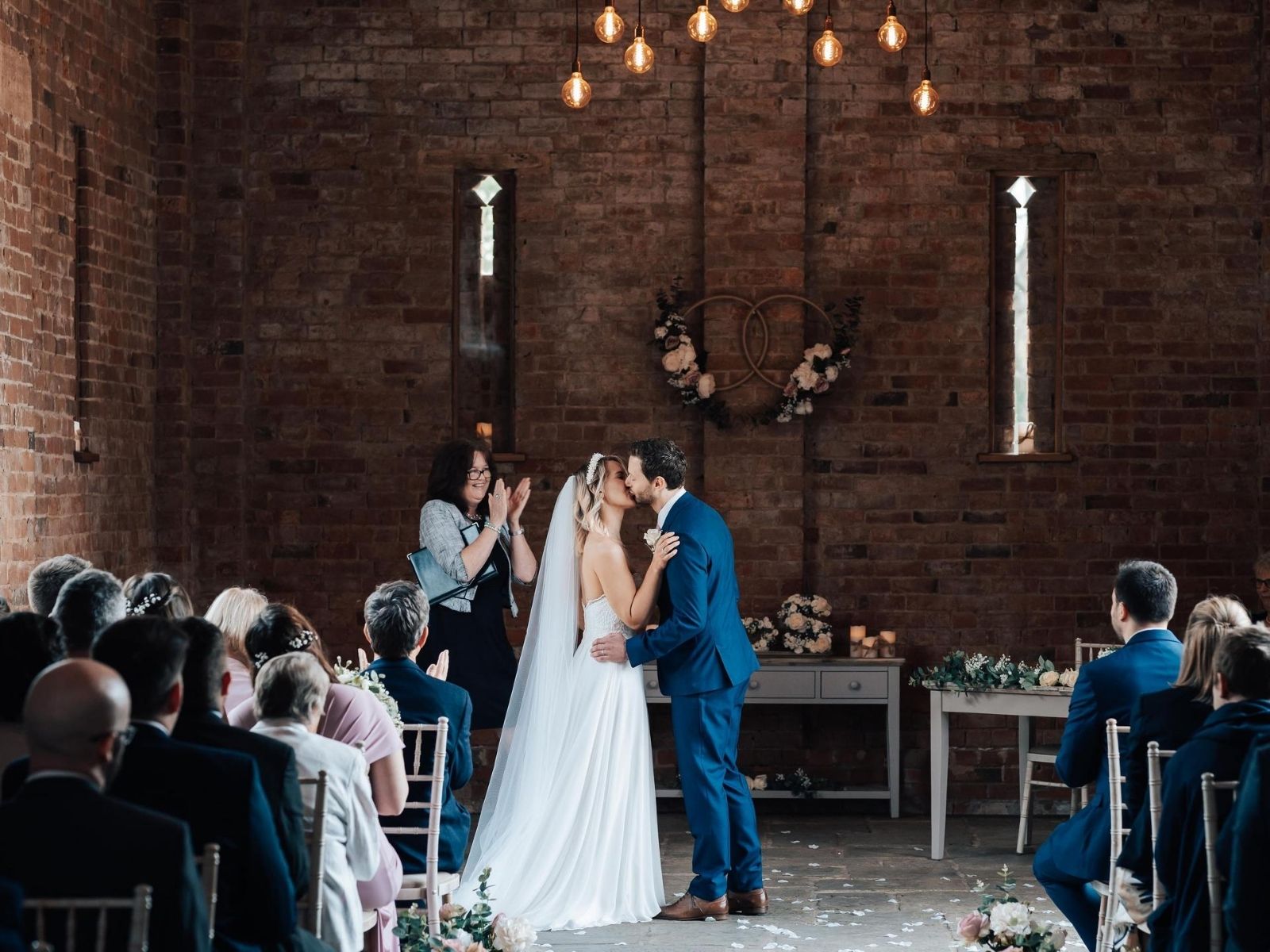 Bride wearing Millie May wedding dress at wedding ceremony at Mickleton Hills Farm wedding venue in Chipping Campden