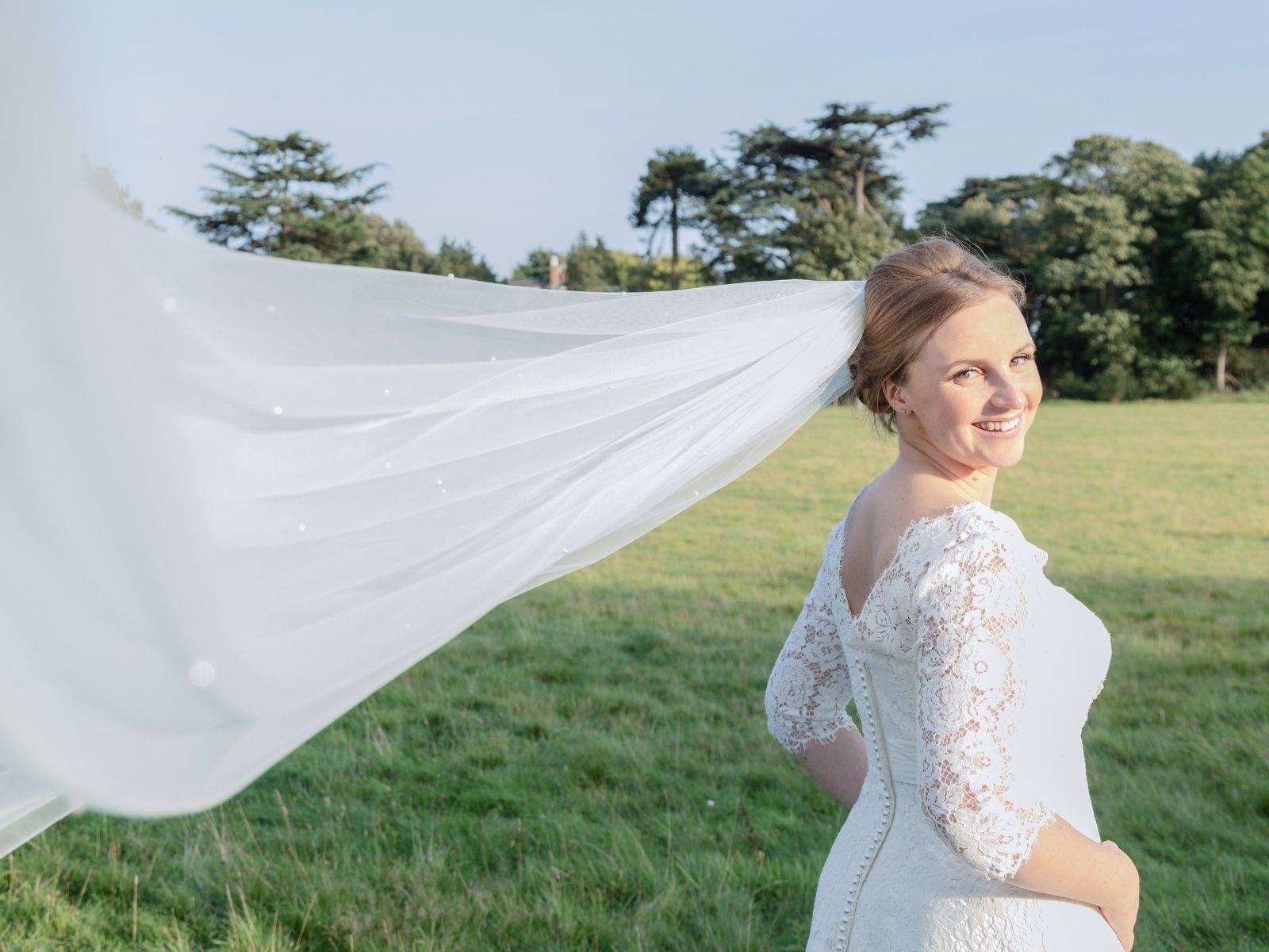 Rachel in her sleeved lace wedding dress