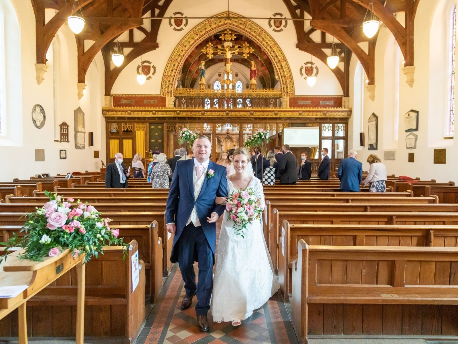 Rachel and Shaun walking out of the church after their ceremony